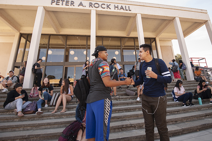 Students on the stairs of Rock Hall