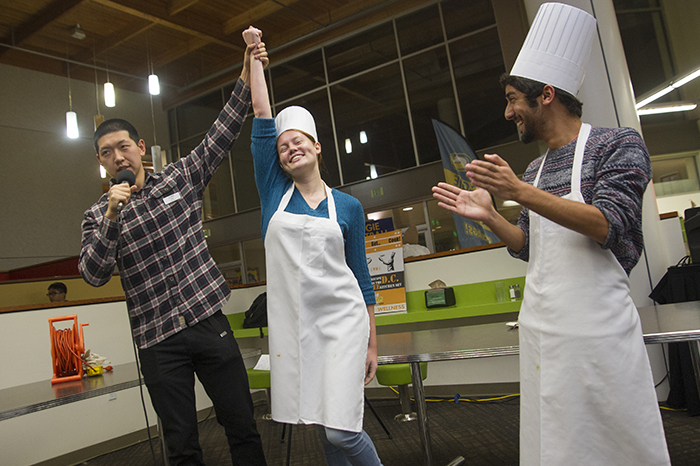 Student with being declared the winner of a cooking contest