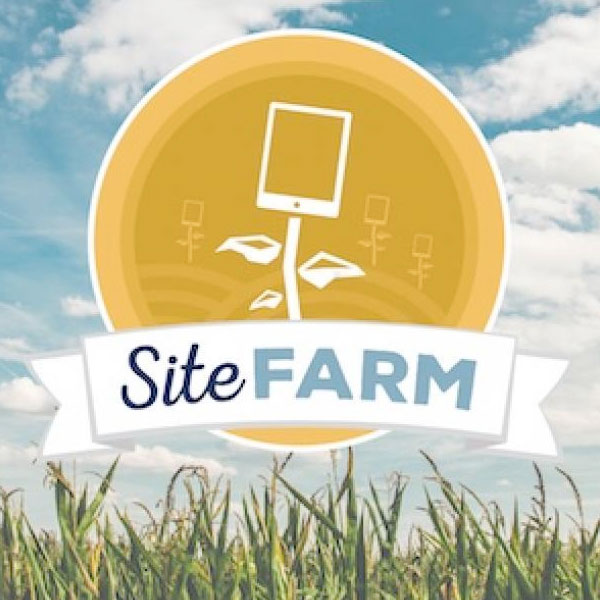 The sitefarm logo over a grassy field